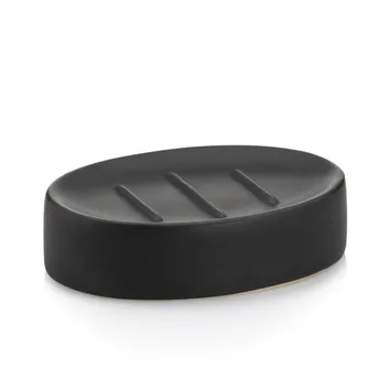 Schwarze ovale Seifenschale mit Rillen und glänzender Oberfläche auf weißem Hintergrund