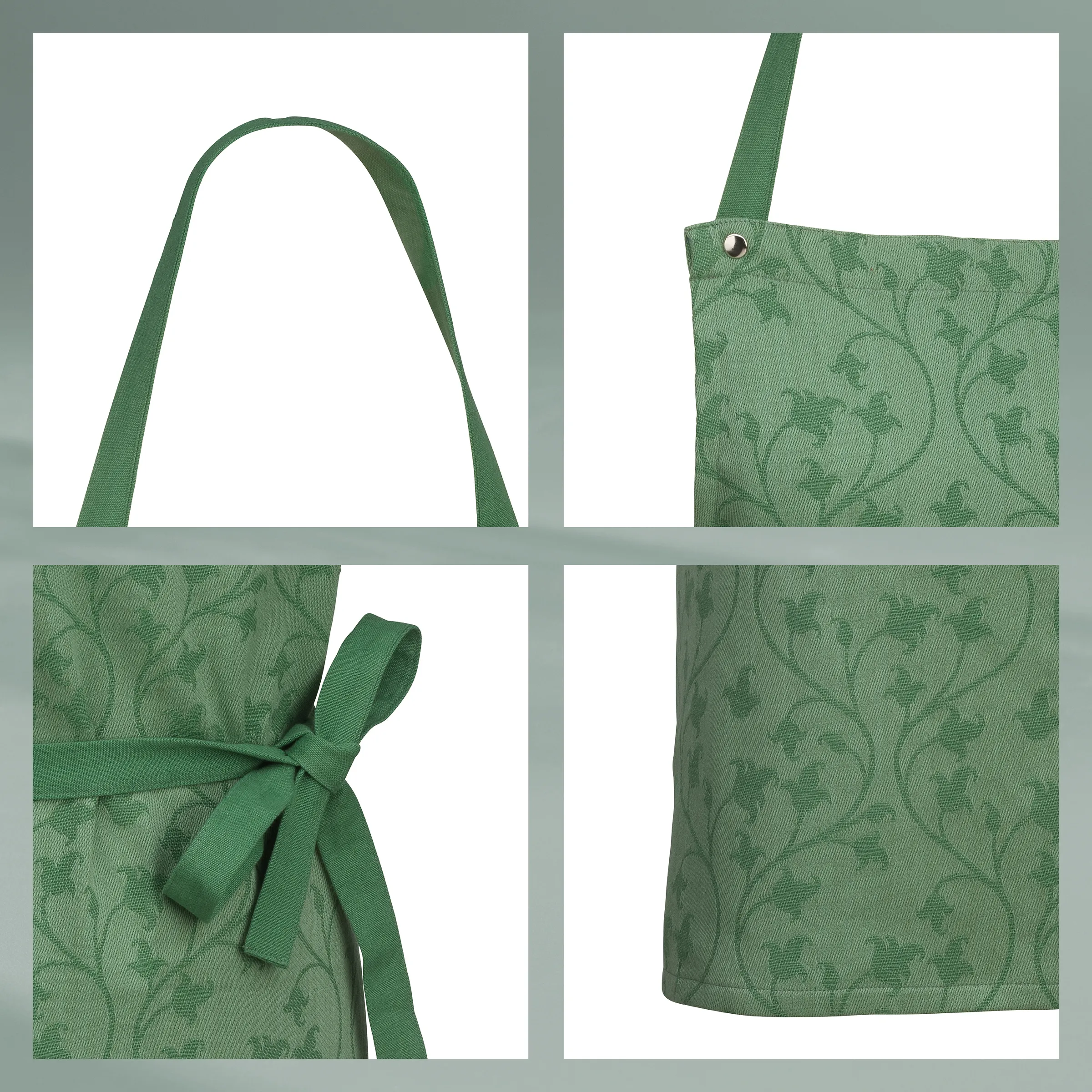 Grüne Küchenschürze mit floralem Muster und Bindebändern Grüne Schürze mit floralem Muster, Nahaufnahme von Träger, Bindebändern und Tasche mit Öse
