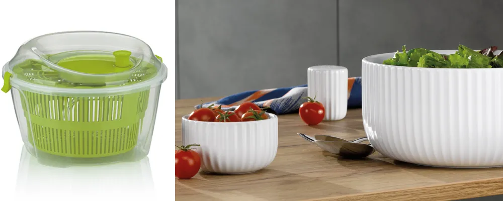Salatschleuder und Servierschalen Set - Küchenhelfer für frische Salate Grüne Salatschleuder und weiße Servierschalen mit Tomaten und Salat auf Holzbrett