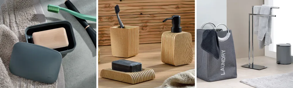 Badezimmeraccessoires bestehend aus Seifenspender, Holzbürste, Wäschekorb und Handtuchständer in modernem Design