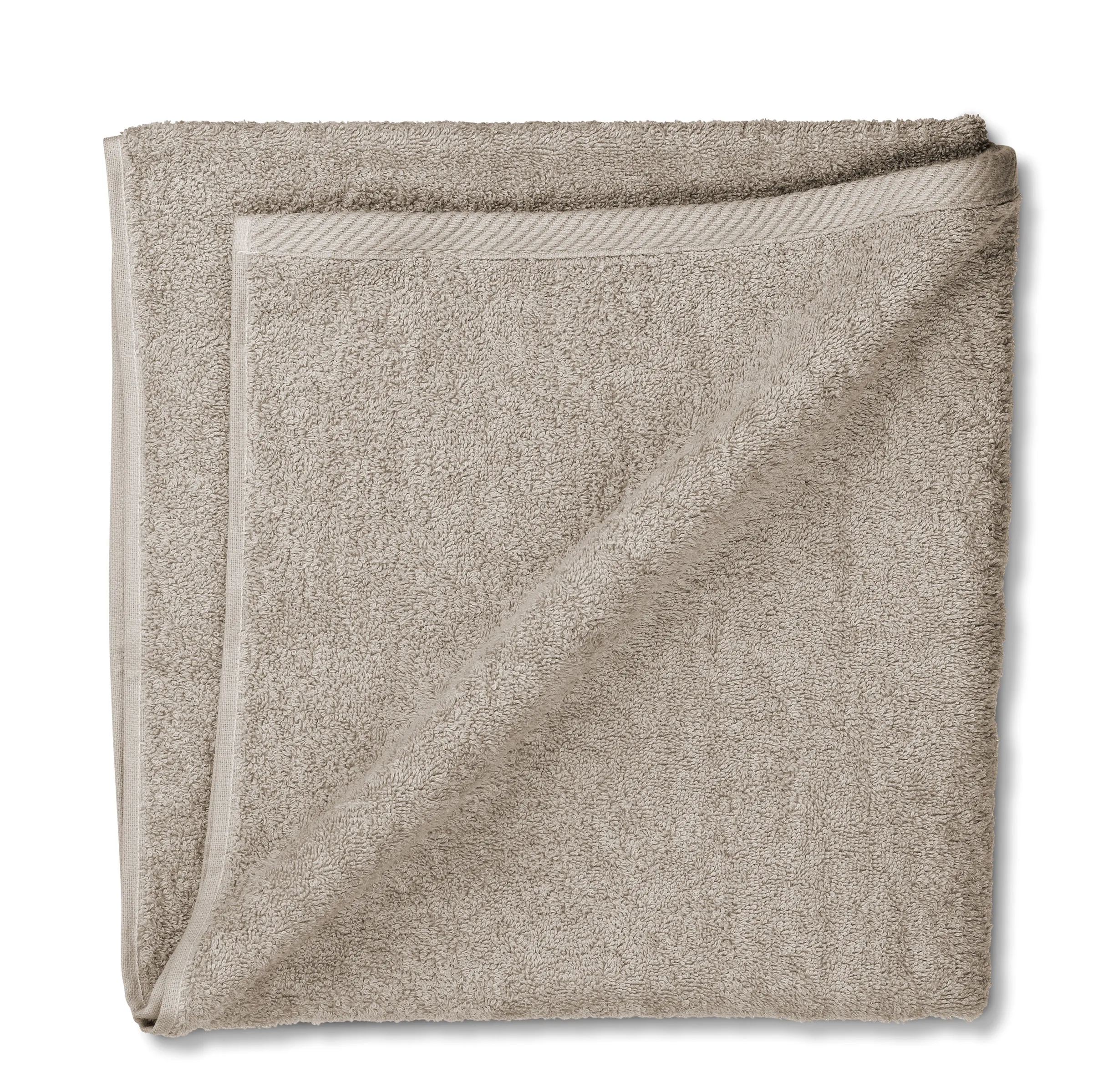 Beige Handtuch Waffelbindung Premium Beiges Handtuch in Waffelbindung, gefaltet und übereinander gelegt, mit sichtbarer Struktur