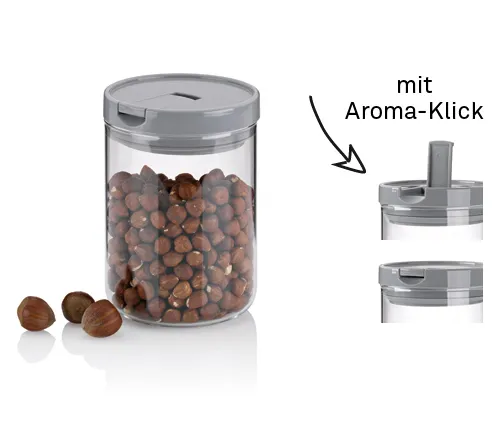 Vorratsdose mit Aroma-Klick für Haselnüsse und Lebensmittel Luftdichte Vorratsdose mit Aroma-Klick-Deckel gefüllt mit Haselnüssen, daneben drei einzelne Nüsse