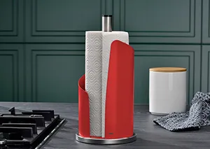 Küchenrollenhalter Rot – Moderner Papierrollenhalter für die Küche Roter Küchenrollenhalter aus Metall mit Küchenrolle auf dunkelgrüner Arbeitsplatte neben Herd und Vorratsdose