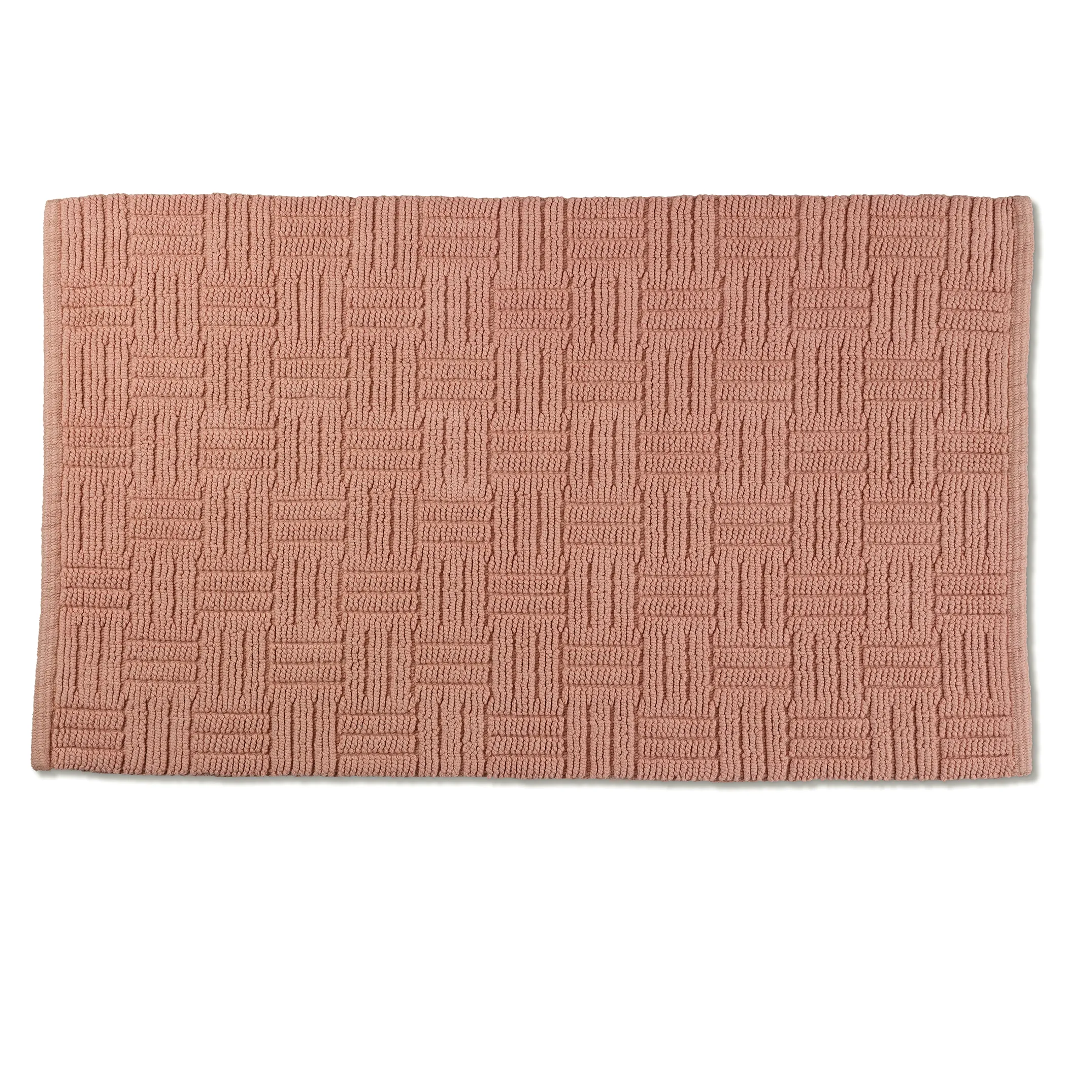 Badematte Rosa mit Würfelmuster – strukturierte Badvorleger Rosafarbene Badematte mit geometrischem Würfelmuster in Reliefstruktur auf weißem Hintergrund