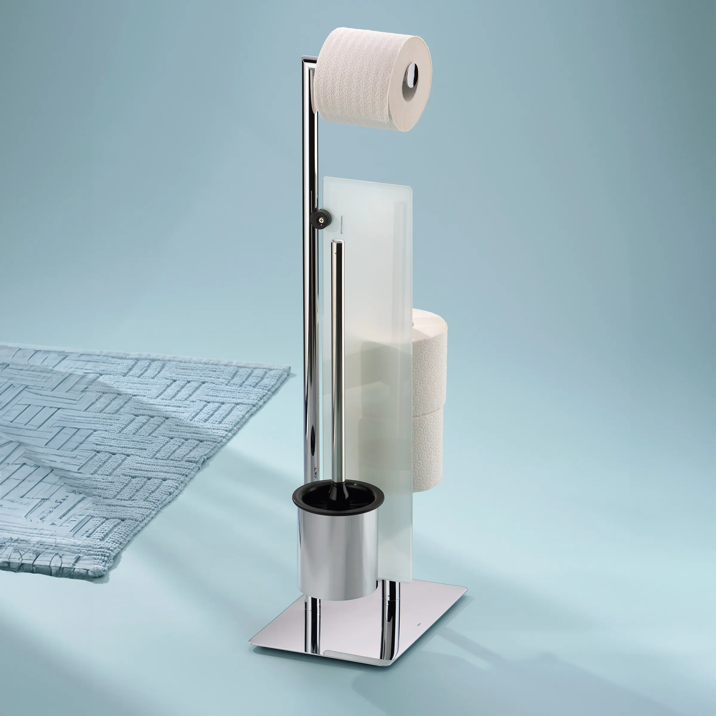 Toilettenbürsenständer Edelstahl mit Papierhalter Moderner Toilettenbürsten- und Papierhalter aus Edelstahl mit weißem Design, komplett bestückt mit Bürste und Papierrollen.
