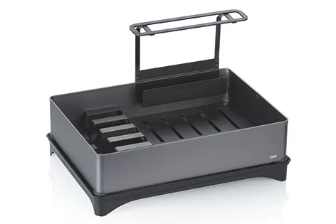 Grillwagen mit Rostfläche und Deckelkonstruktion Grauer Grillwagen mit schwarzem Grillrost, Seitengriffen und aufklappbarem Deckel auf schwarzen Kunststofffüßen