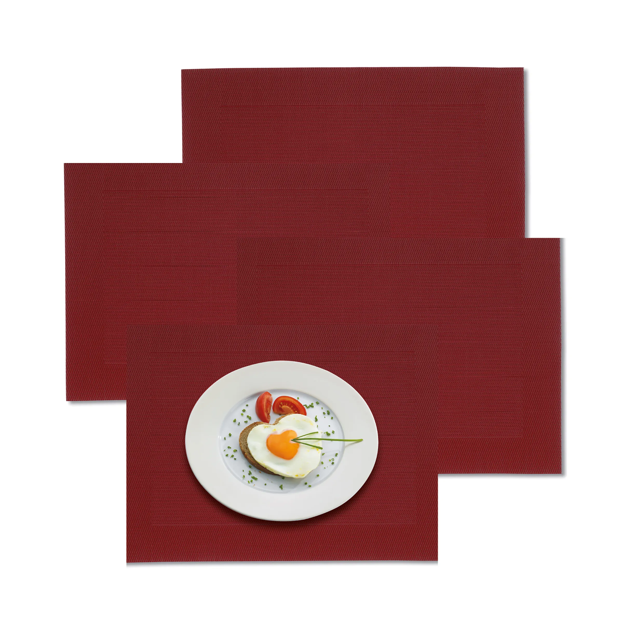 Red Placemat Design - Premium Table Setting White plate with fried egg, tomato and herbs on textured red background with geometric pattern