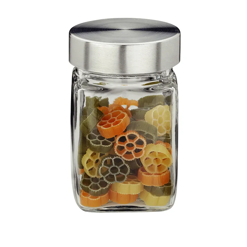 Bunte Pasta Formen in Aufbewahrungsglas Glastopf mit Metalldeckel gefüllt mit bunten Pasta-Formen in Orange, Gelb und Grün