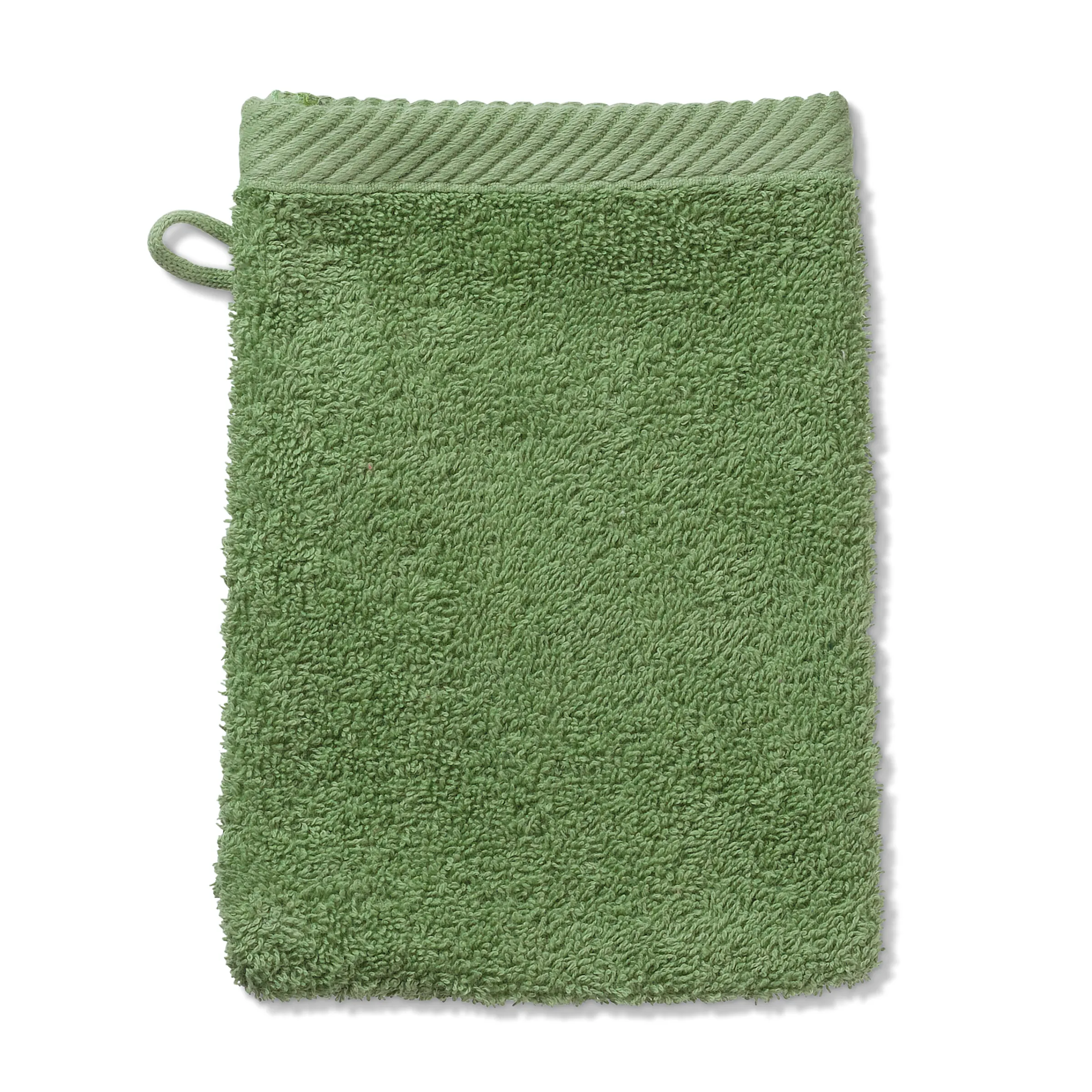 Grüner Frottee Waschhandschuh mit Aufhängeschlaufe Grüner Waschhandschuh aus weichem Frottee mit Aufhängeschlaufe, flach auf weißem Hintergrund