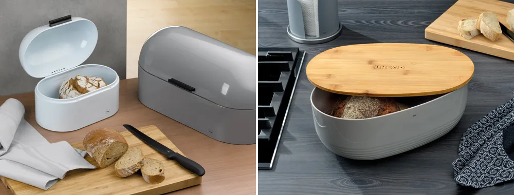 Brotkasten Brotbox mit Bambusdeckel - moderne Brotkästen für die Küche Moderne Brotboxen in weiß und grau mit Bambusdeckel auf Küchenarbeitsplatte mit frischem Brot