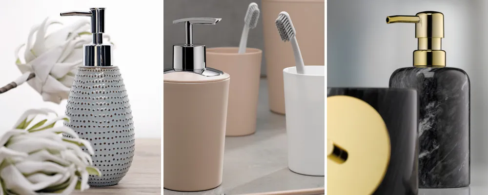 Drei moderne Badezimmer-Accessoires: Grauer Seifenspender mit Punktmuster, beige Zahnbürstenhalter und schwarzer Flüssigseifenspender mit Goldpumpe