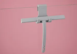 Ausziehbarer Wandhaken Metall weiß - Garderobenhaken Wandmontage Weißer Metallhaken an rosa Wand zur Wandmontage mit ausziehbarem Armsystem