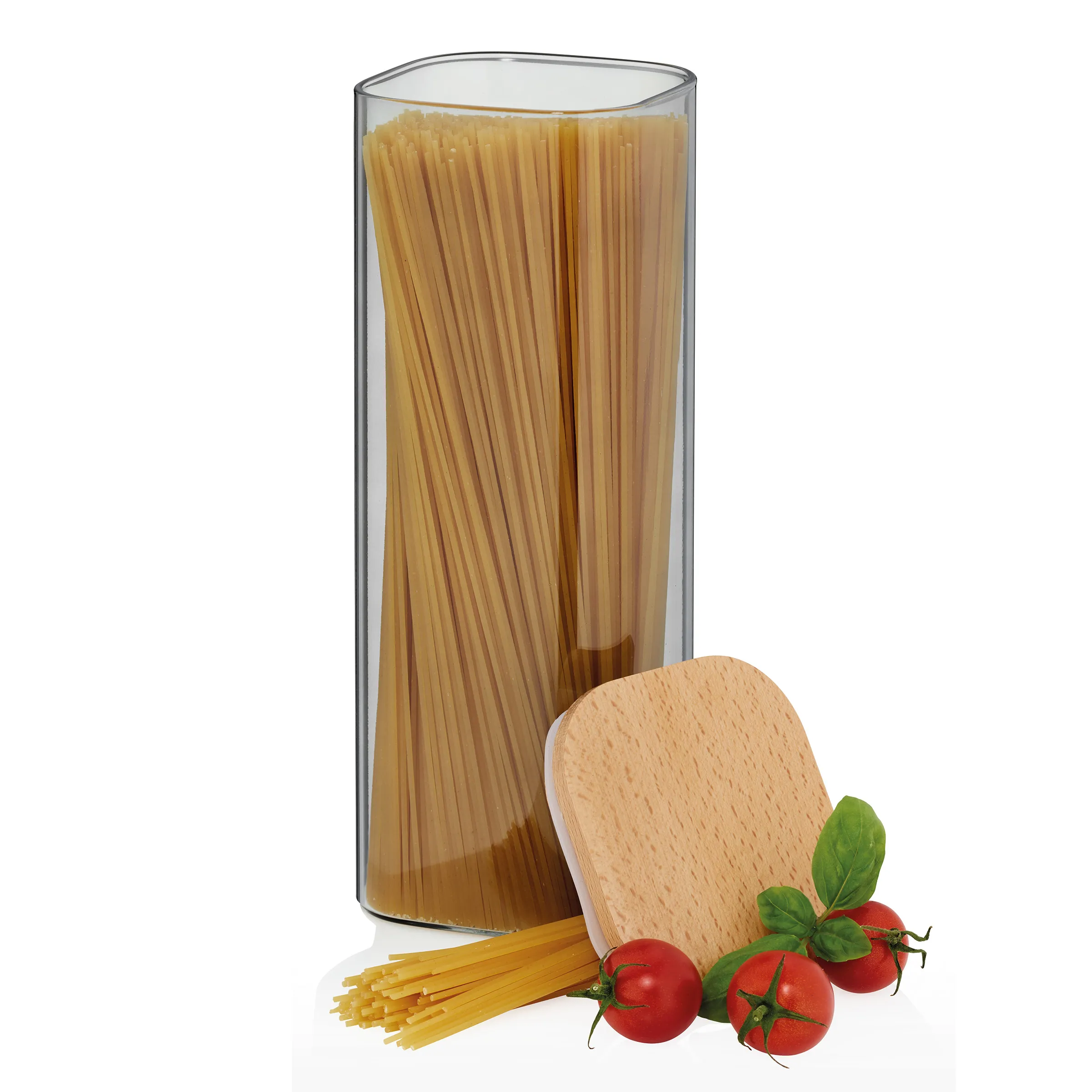 Pasta Aufbewahrung - Spaghetti in Glas mit Zutaten Glasbehälter mit Spaghetti-Pasta, Holzlöffel und frischen Tomaten mit Basilikum
