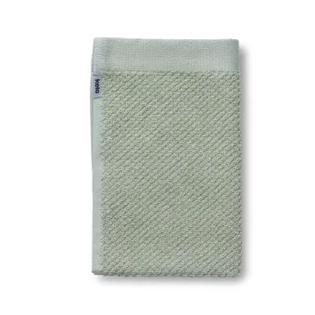 Mint-grünes Handtuch aus Baumwolle mit strukturiertem Webmuster und blauem Markenlogo auf der Seite