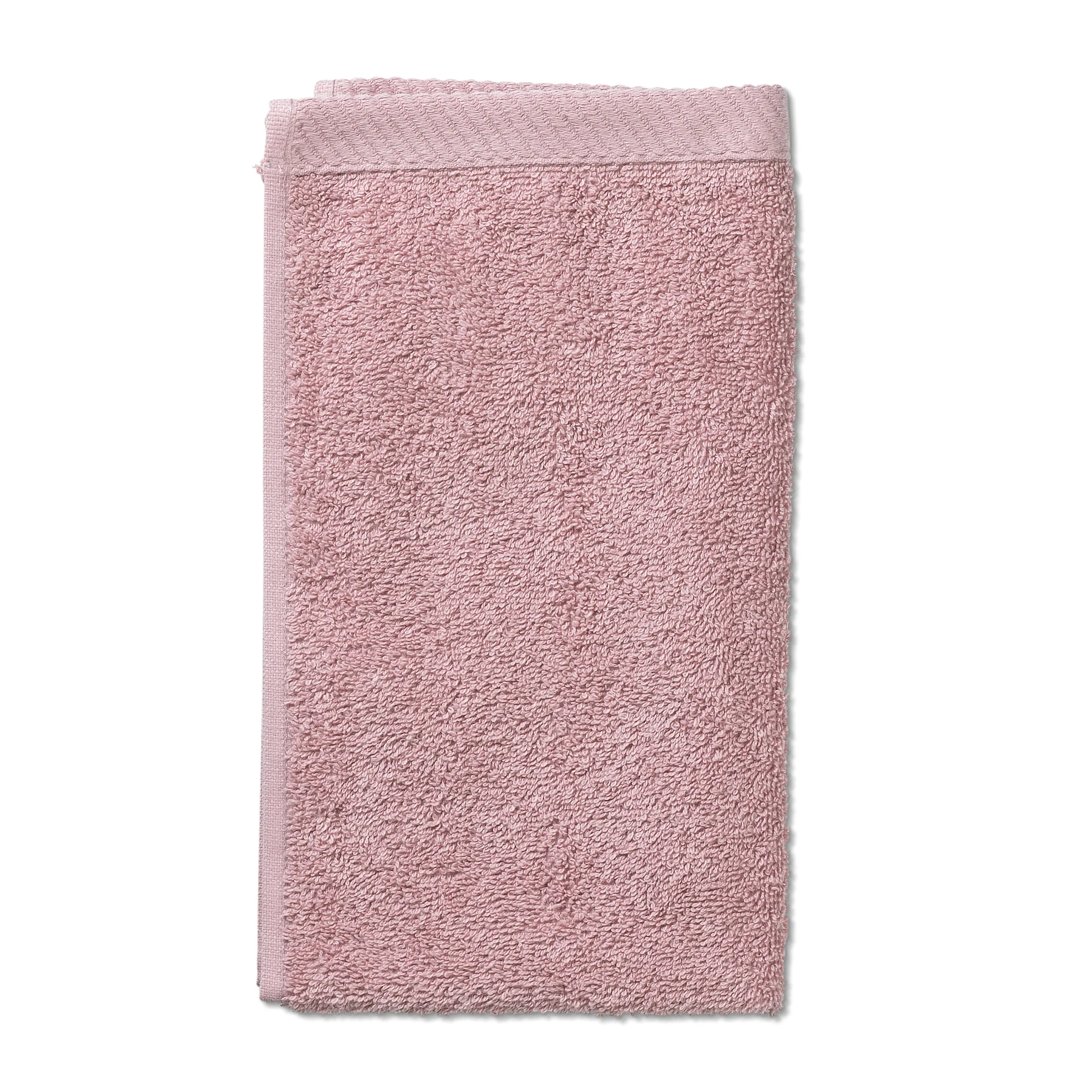 Rosa Waschhandschuh Baumwolle - Weicher Frottee Waschlappen Rosa Waschhandschuh aus weicher Baumwolle mit strukturierter Frottee-Oberfläche auf weißem Hintergrund