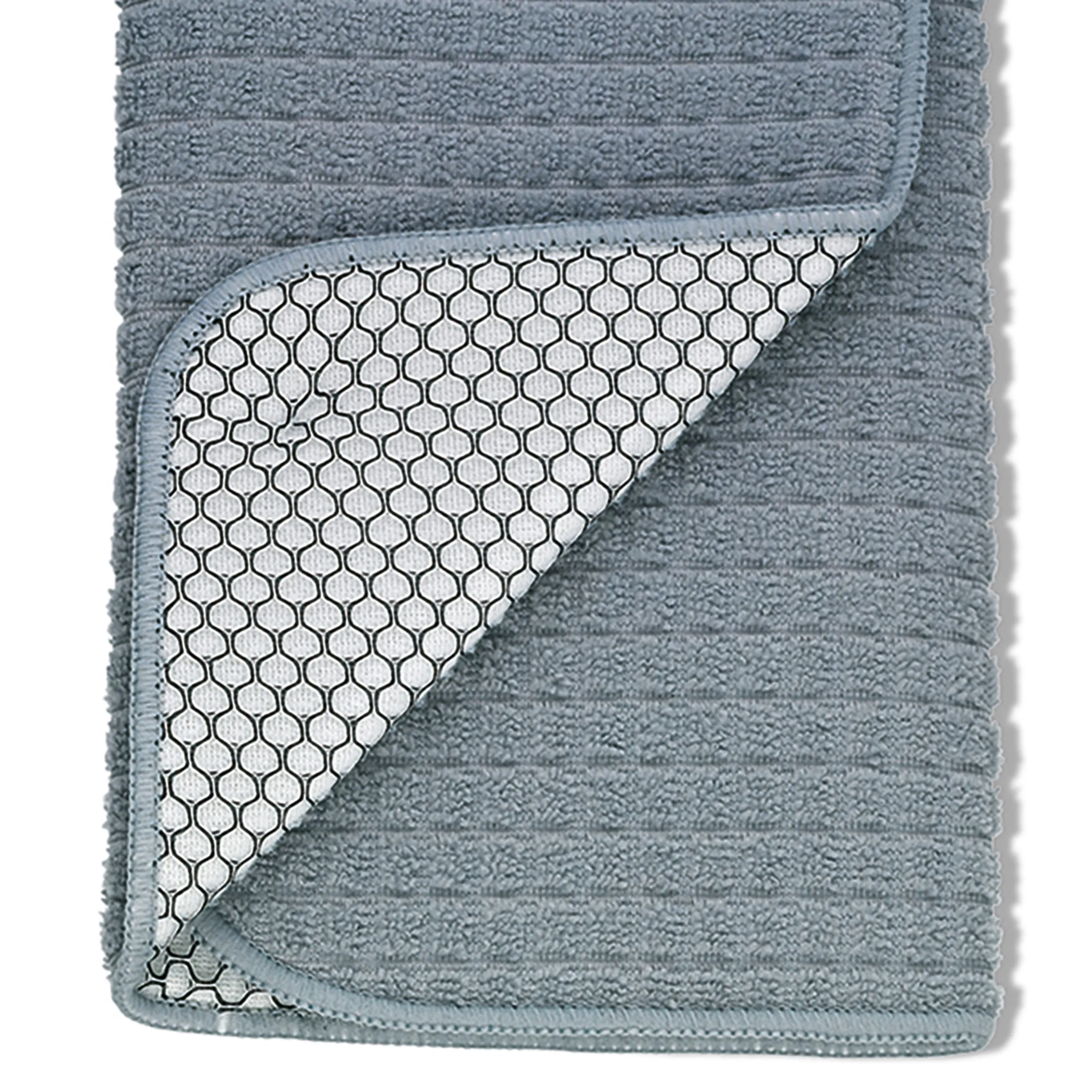 Strickdecke Wabenmuster grau - hochwertige Kuscheldecke Graugrüne Strickdecke mit umgekehrter Seite, die ein geometrisches Wabenmuster in Weiß und Dunkelgrau zeigt