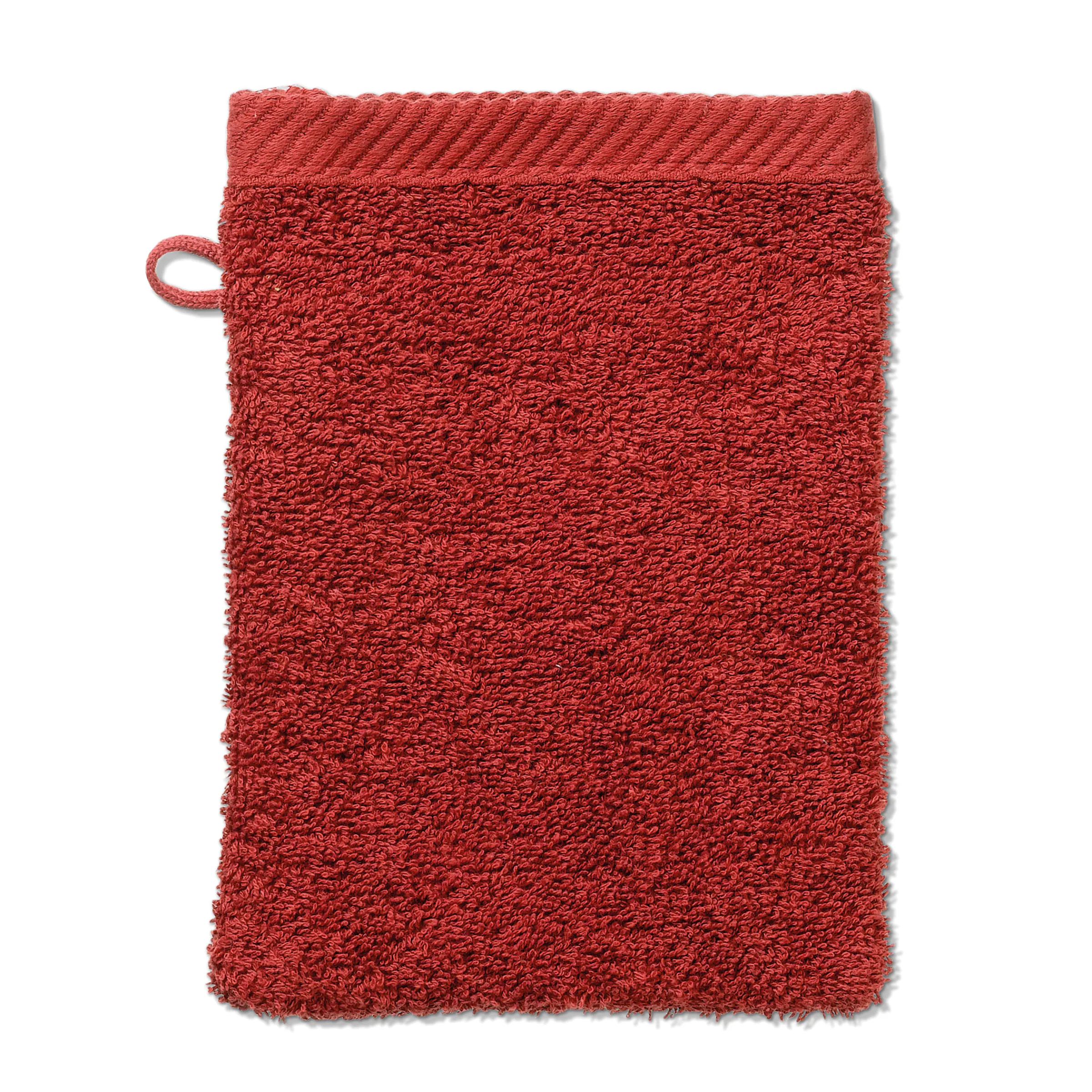 Waschhandschuh Rot Frottier Rotes Frottier-Waschhandschuh mit Schlaufe und strukturierter Oberfläche vor weißem Hintergrund