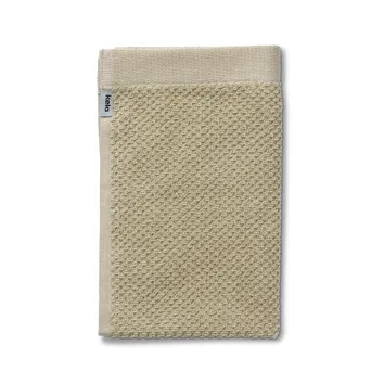 Beige Waffelpiqué-Handtuch mit strukturiertem Muster und Kela-Etikett auf weißem Hintergrund