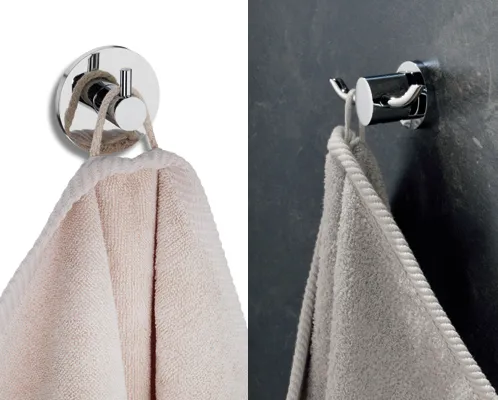 Handtuchhalter Saugnapf - Wandmontage Badezimmer Zwei moderne Handtuchhalter mit Saugnapf-Befestigung halten helle Handtücher an Wand und Fliesen.